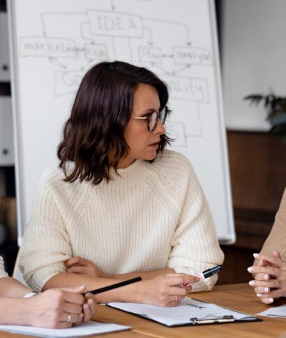 business-women-discussing-table_23-2148911779 business-women-discussing-table_23-2148911779
